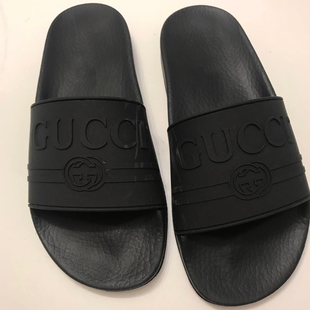 Gucci logo slides